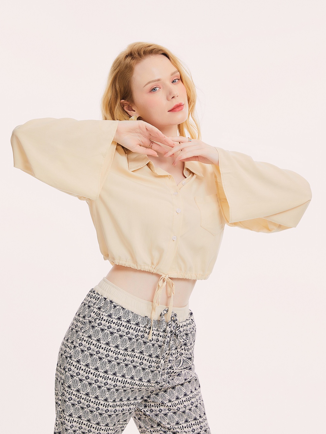 

URBANIC Beige Solid Drawstring Placket Crop Top