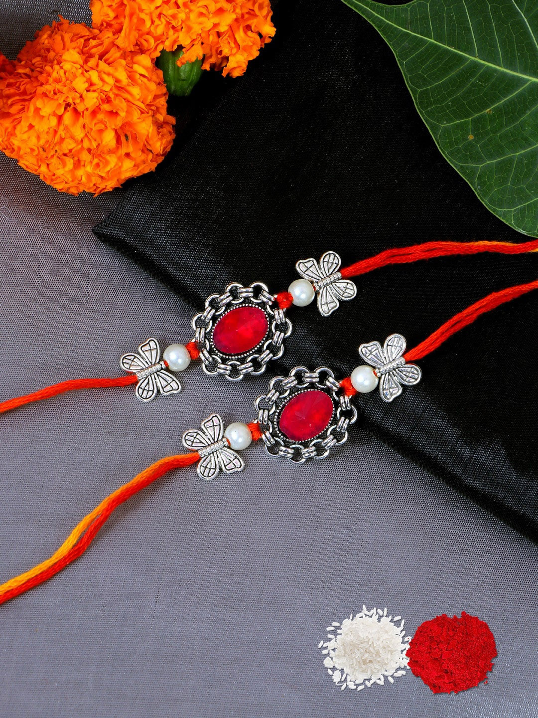 

Crunchy Fashion Women Pack Of 2 Oxidized German Silver Toned Floral Red Stone Rakhi