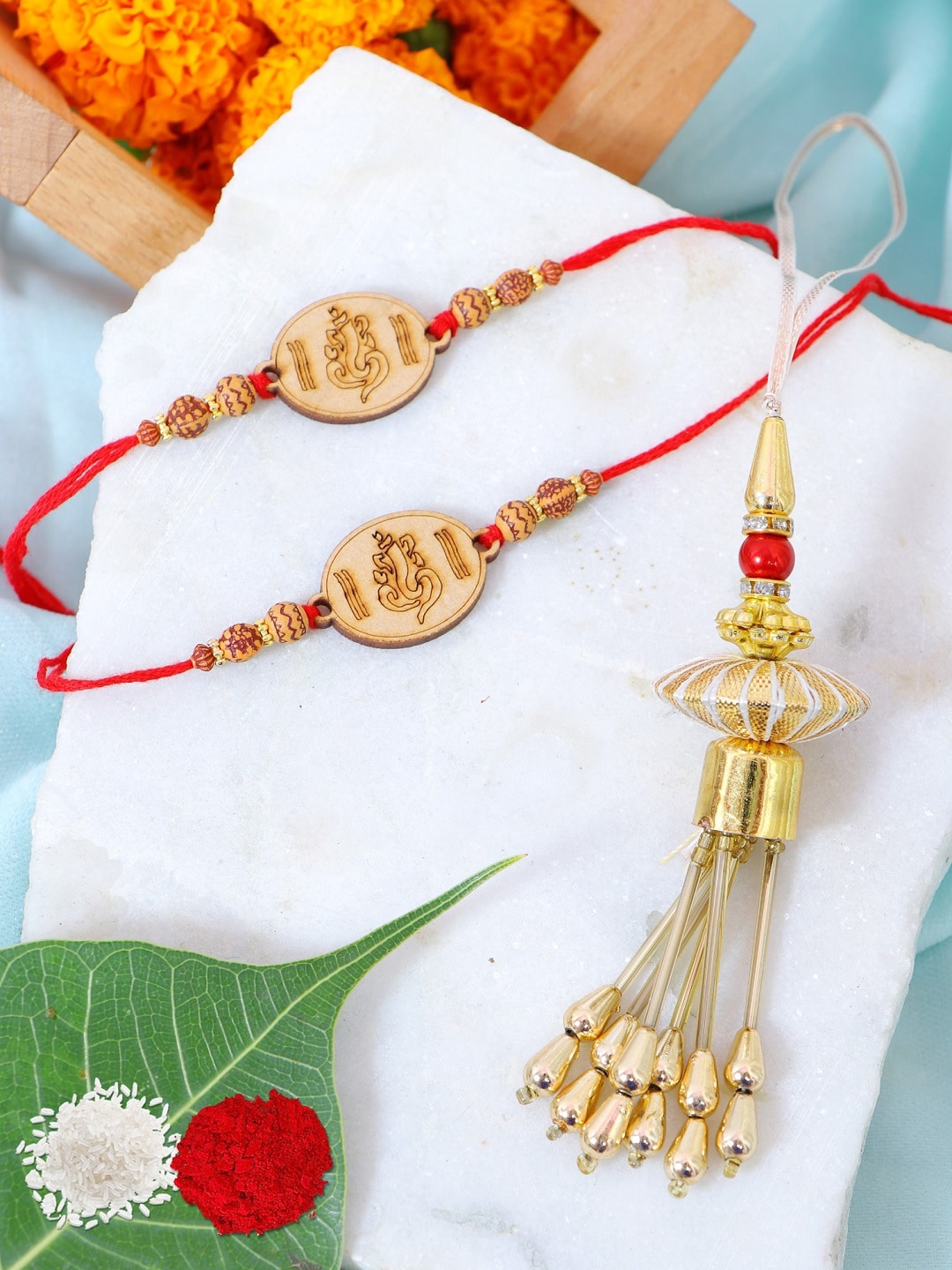 

Crunchy Fashion Set of 3 Lord Ganesha Rakhi With Roli Chawal, Brown