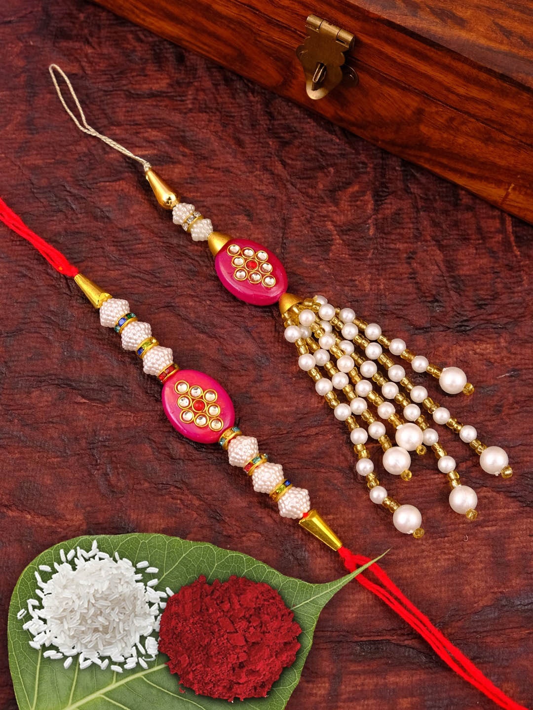

Crunchy Fashion Pack of 2 Kundan And Pearls Studded Rakhi With Roli Chawal & Tilak, Multi