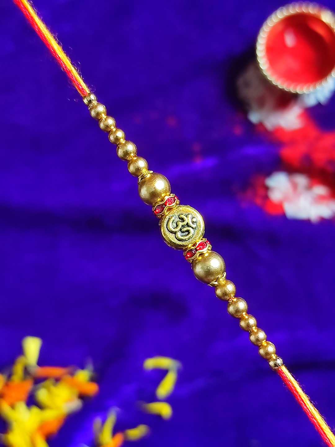 

CRAYTON Men Red & Gold-Toned Beaded Om Rakhi