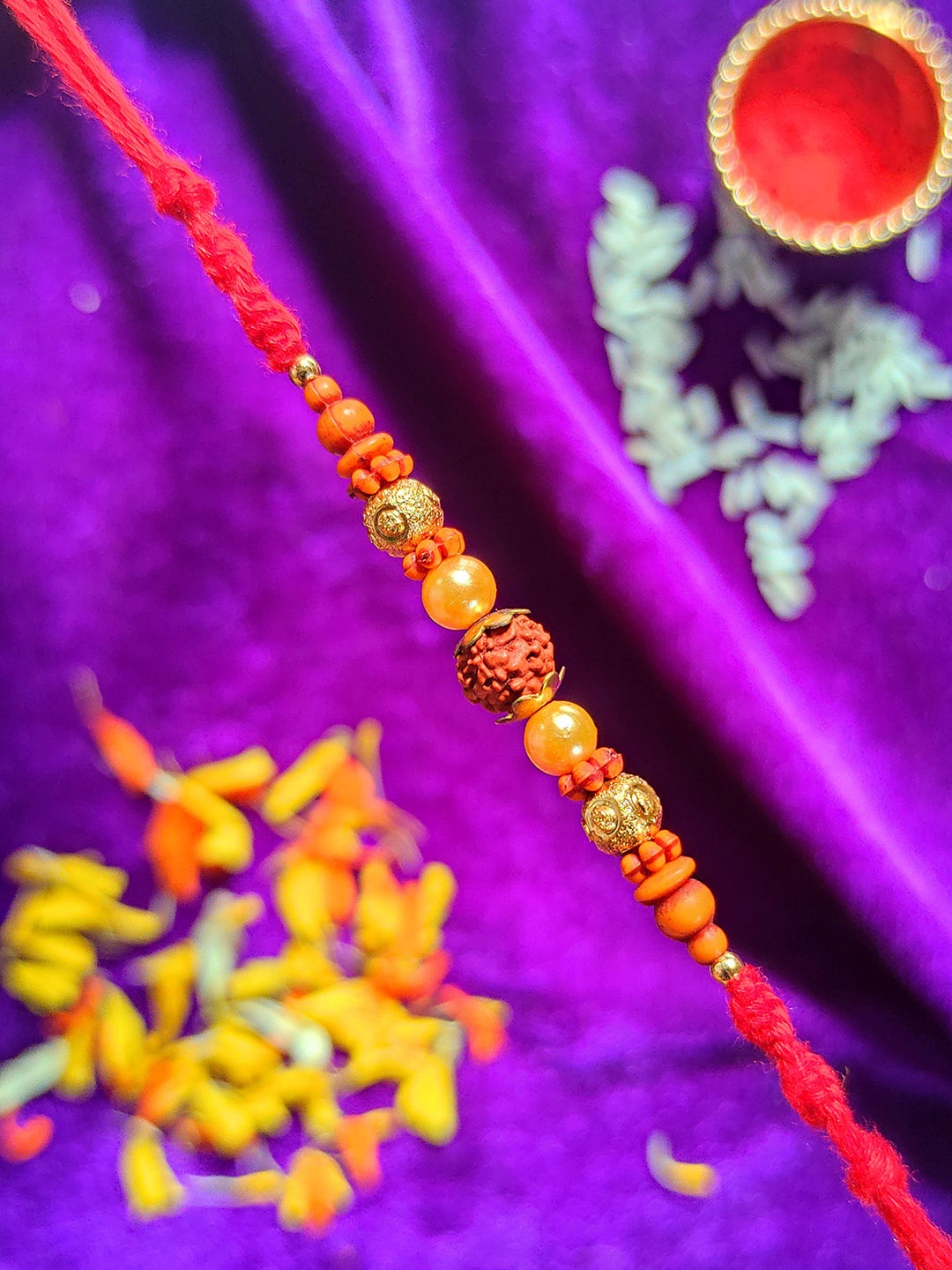 

CRAYTON Men Red Rudraksh Studded Rakhi