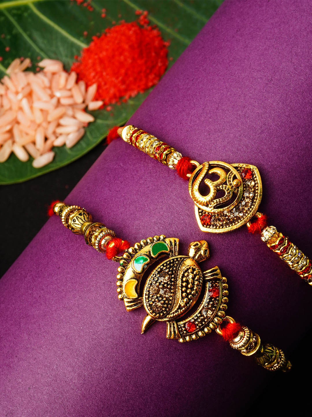 

Urmika Men Set Of 2 Red & Gold-Coloured Stone-Studded Rakhi, Multi