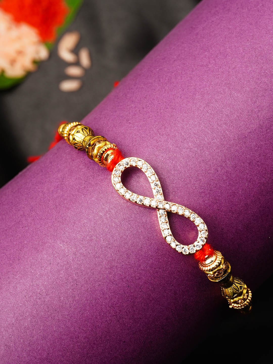 

Urmika Men Gold-Toned & White Beaded Rakhi