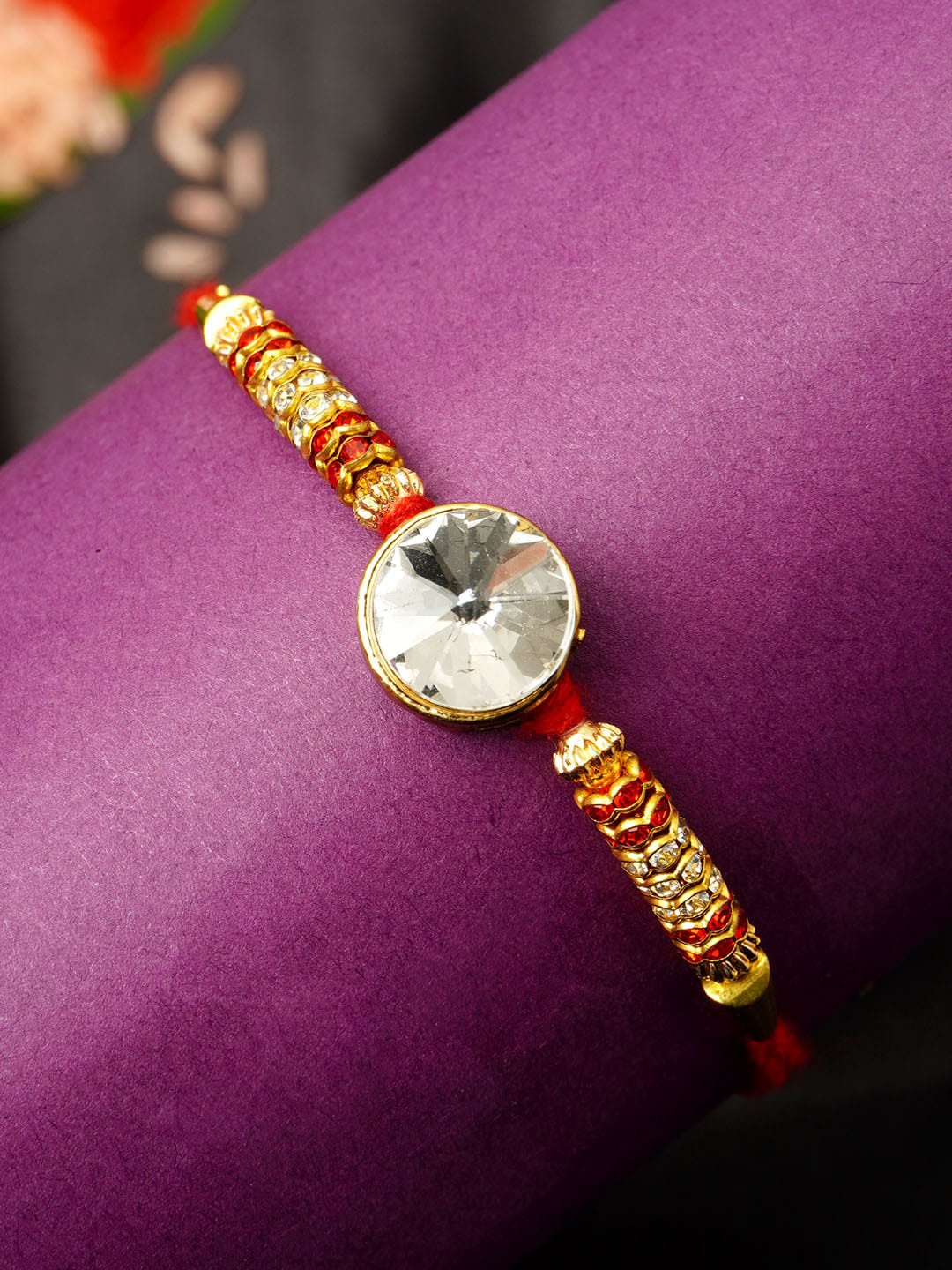 

Urmika Men Gold-Toned White & Red Stone-Studded & Beaded Rakhi