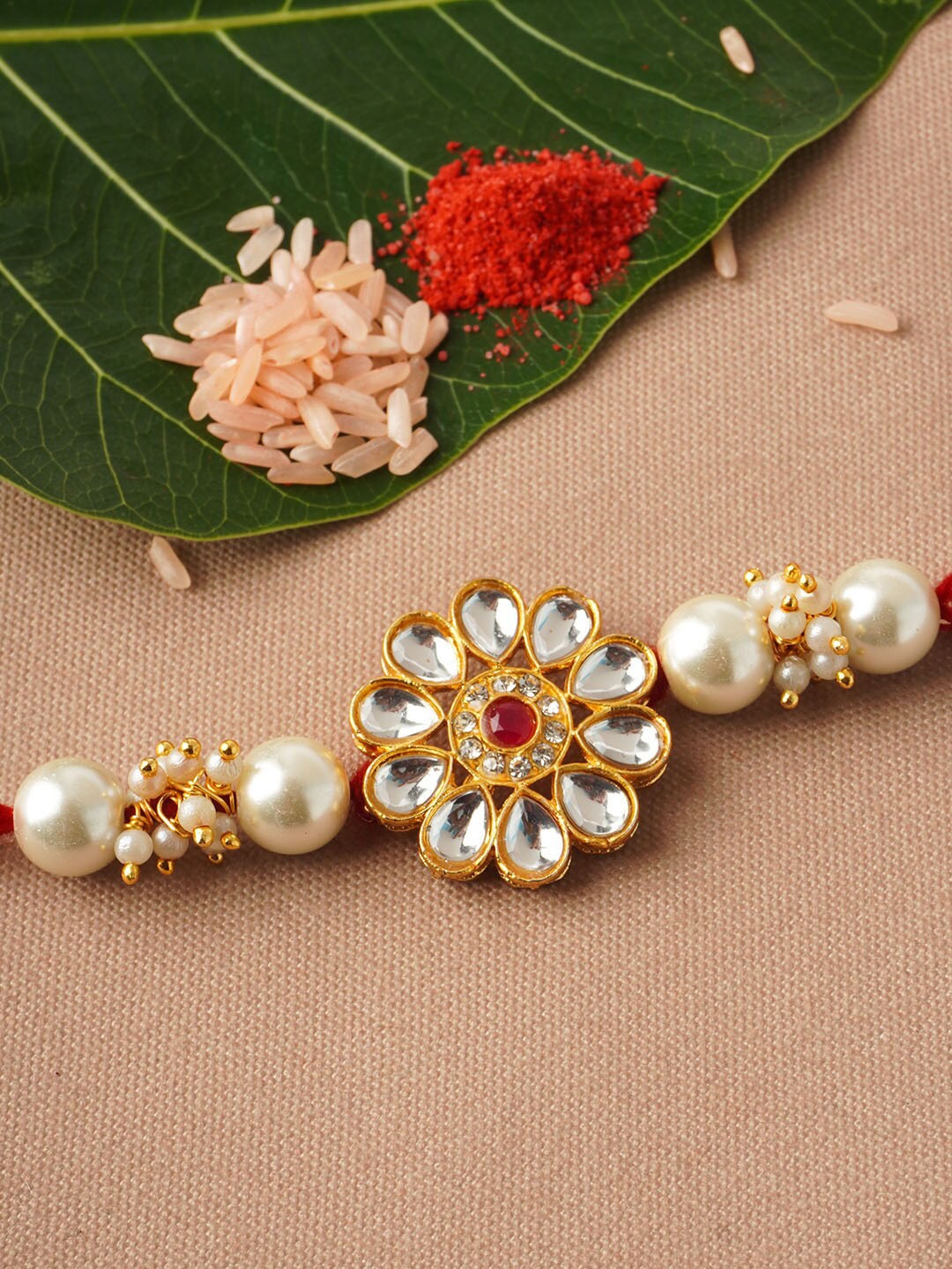 

Urmika Men White & Red Floral Pearl Beaded Rakhi