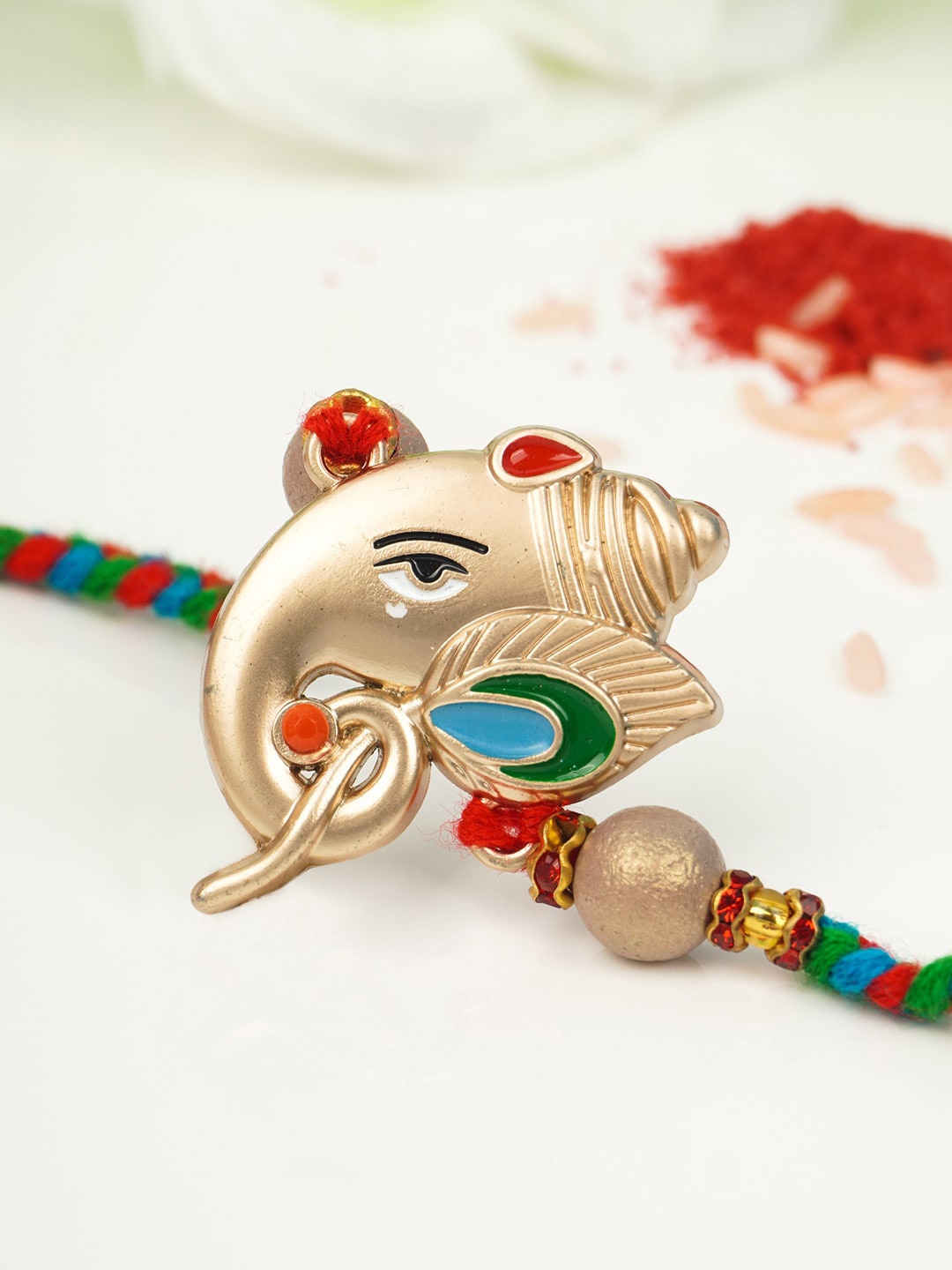

Urmika Men Gold-Toned & Blue Ganesh Designed Rakhi