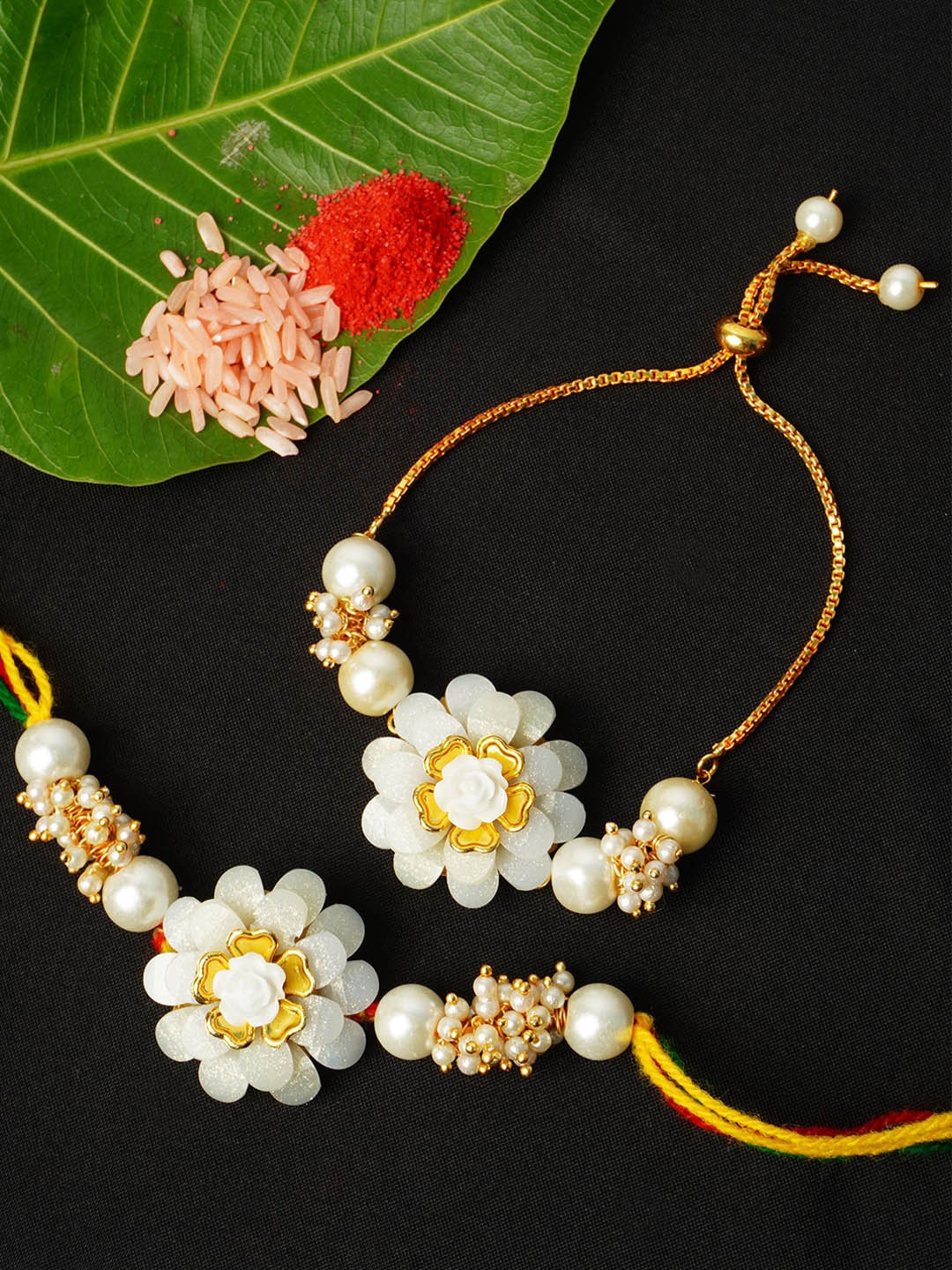 

Urmika Set of 2 White & Golden Rakhi With Roli Chawal
