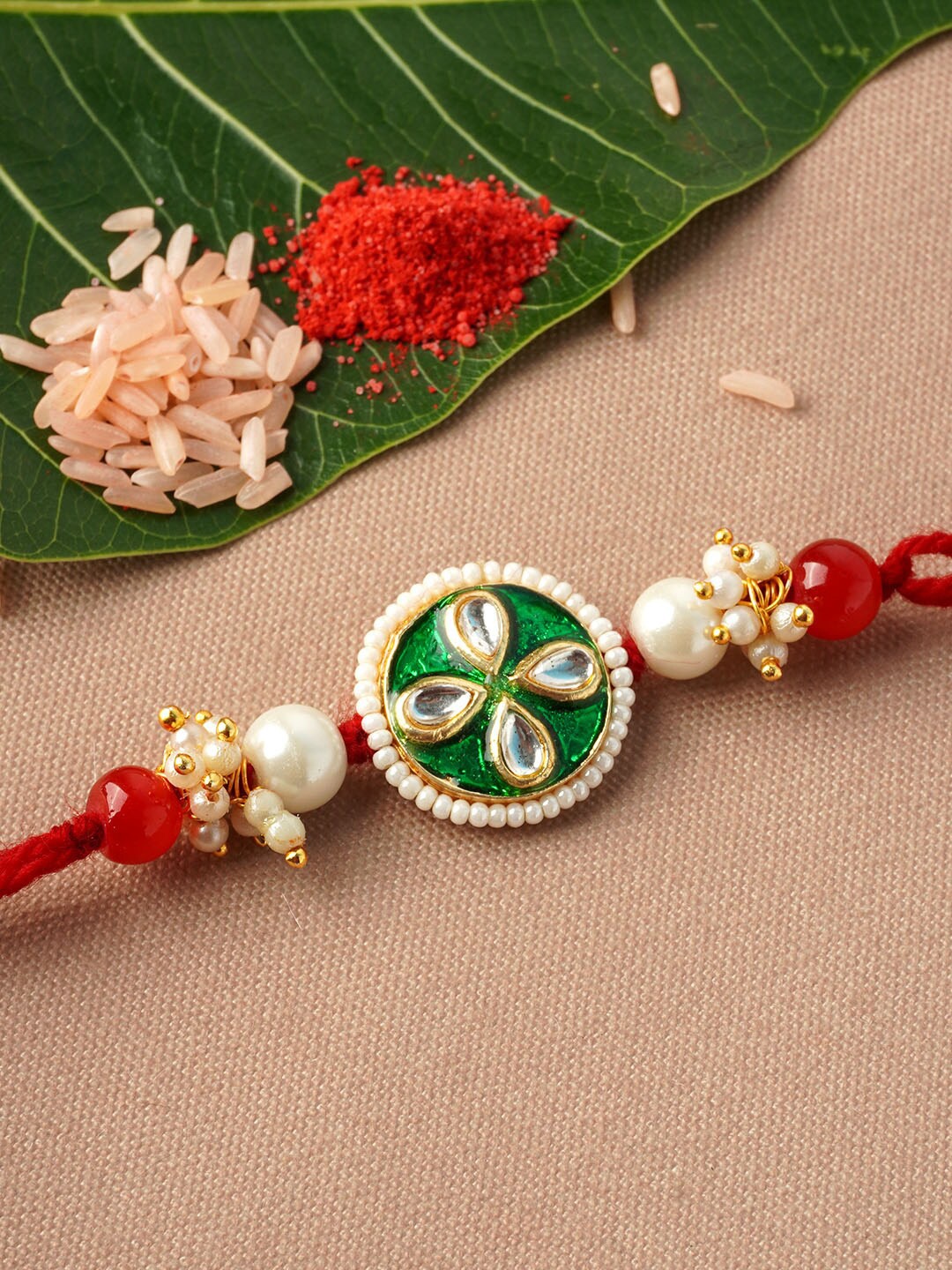 

Urmika Green & White Crystal Round Rakhi With Roli Chawal
