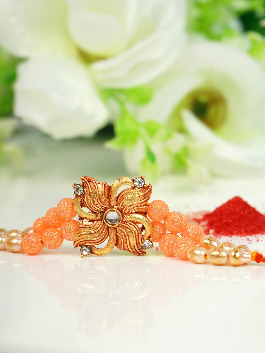 

Urmika Men Gold-Toned White & Orange Stone-Studded & Beaded Rakhi