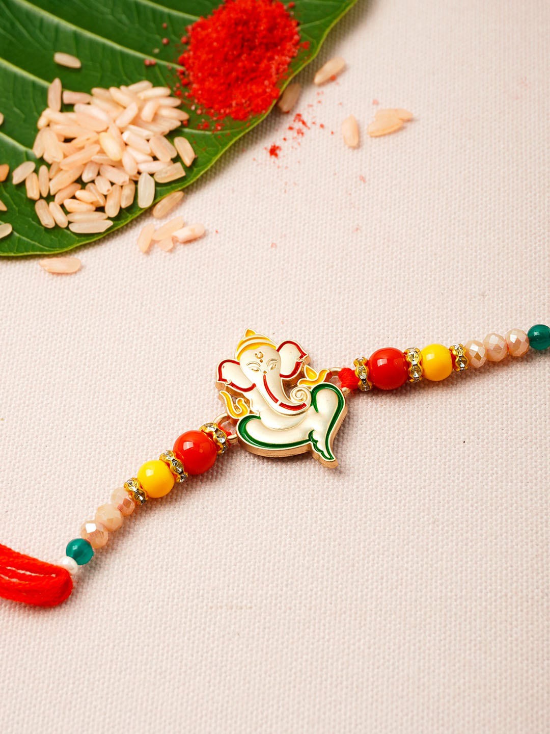 

Urmika Golden & Red Ethnic Rakhi With Roli Chawal, Gold