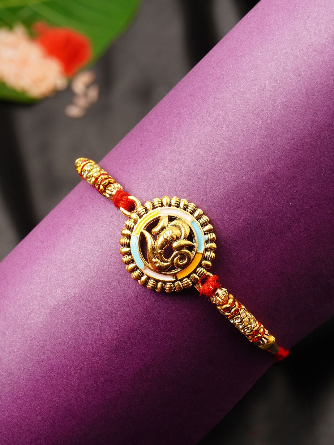 

Urmika Men Gold-Toned Red & White Stone Studded Ethnic Rakhi With Roli Chawal