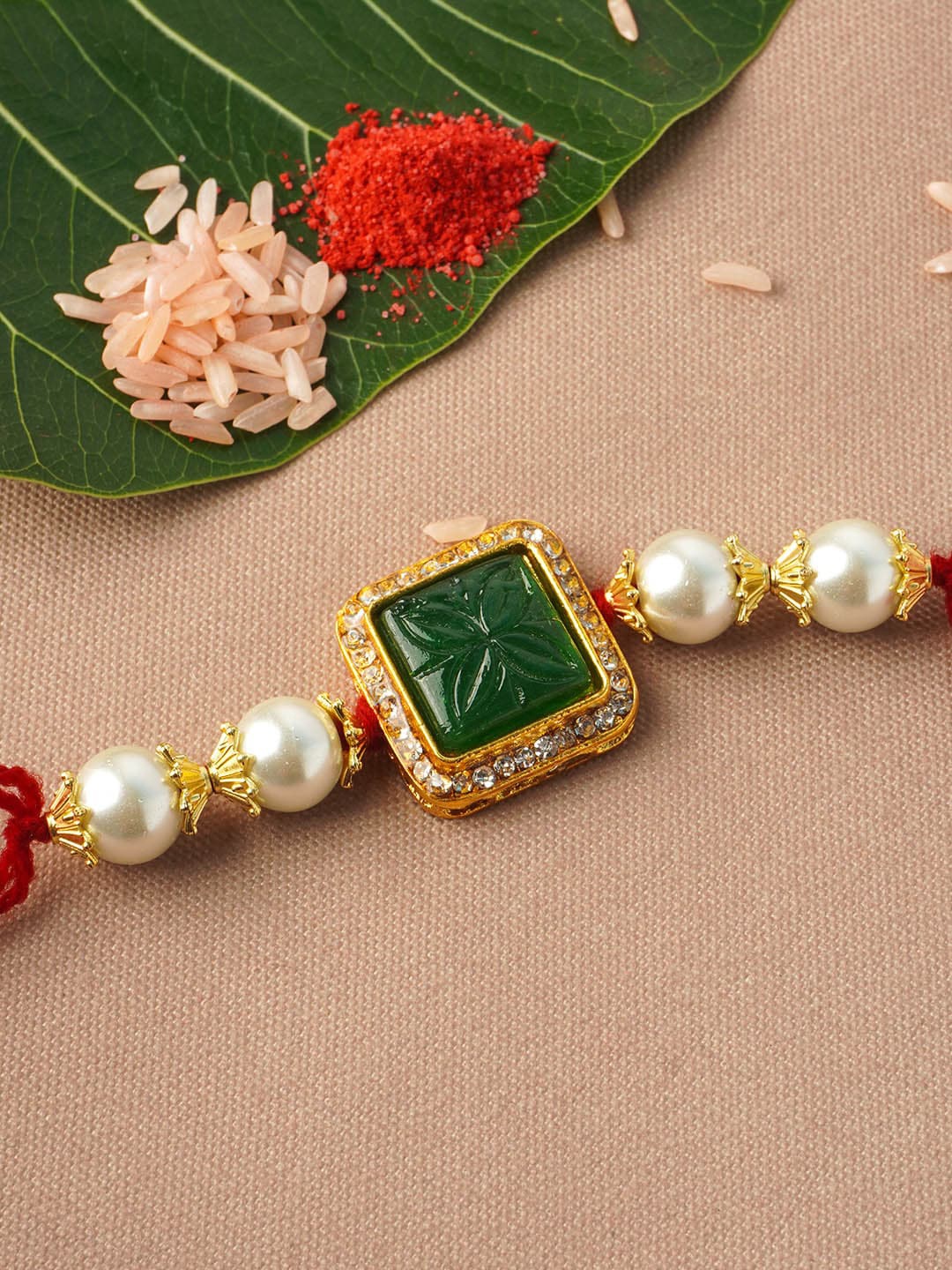 

Urmika Men Gold Toned & White Crystal Beaded Rakhi