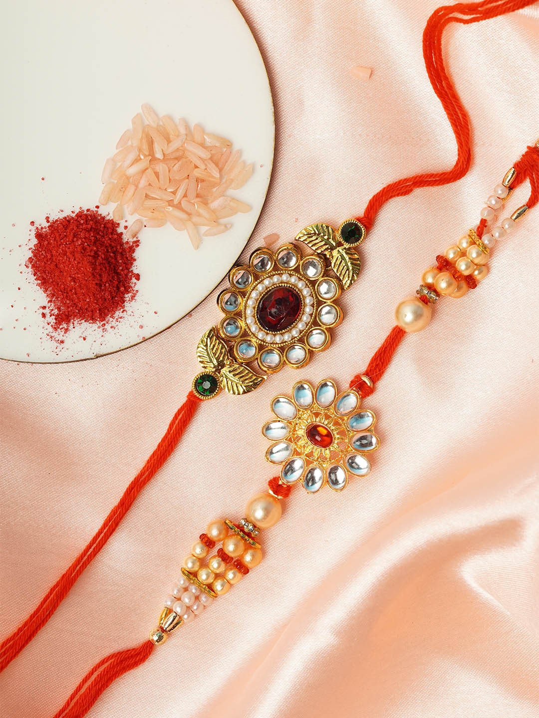 

Urmika Men Pack of 2 Gold-Toned & Red Beaded Leafy Floral Rakhi