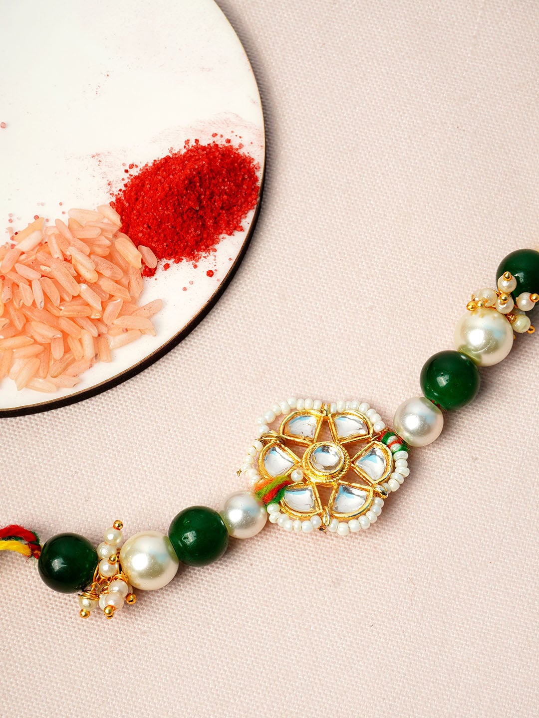 

Urmika Men White & Green Beaded Rakhi