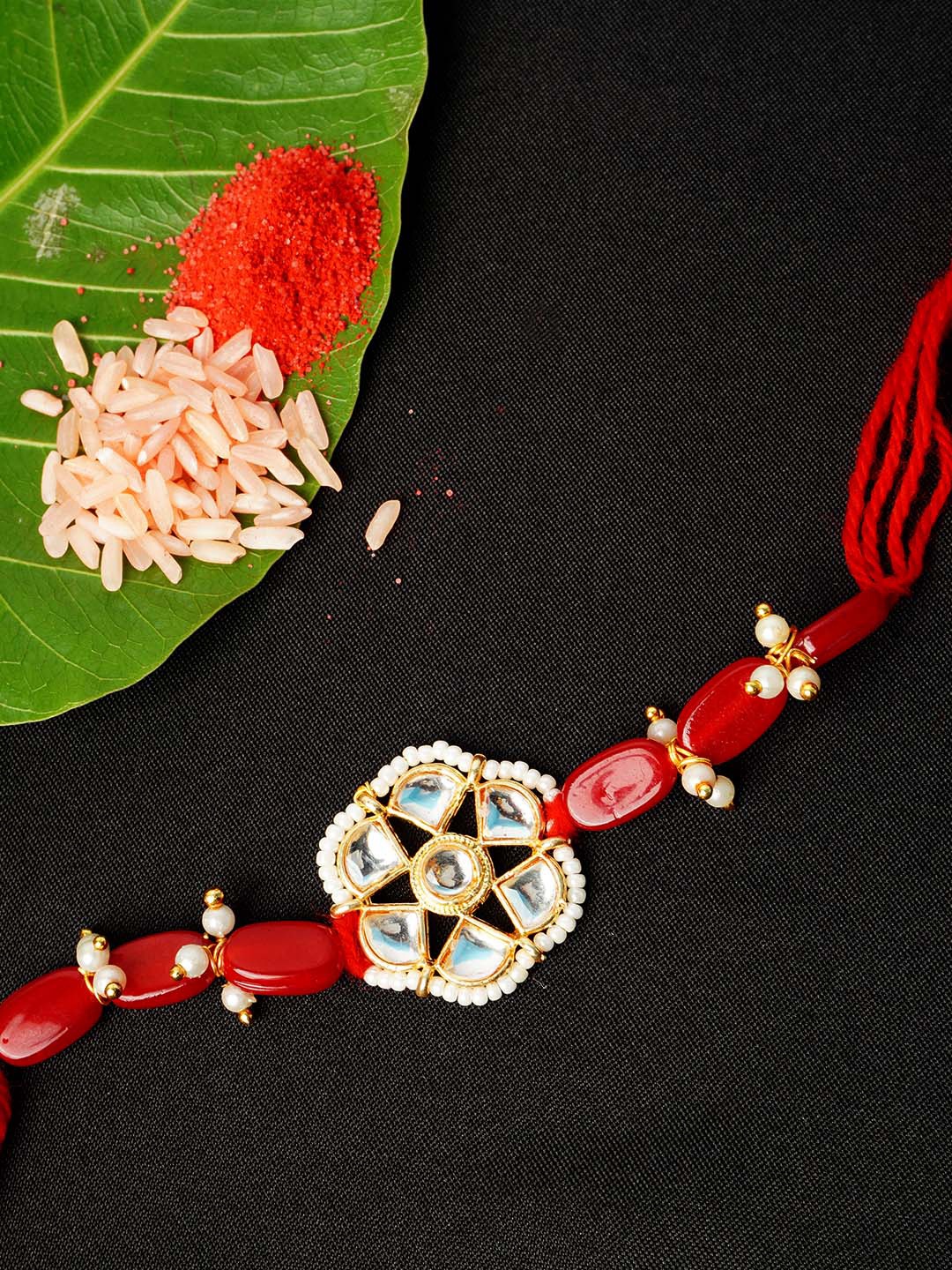 

Urmika Men Red Beaded & White Stone Studded Rakhi