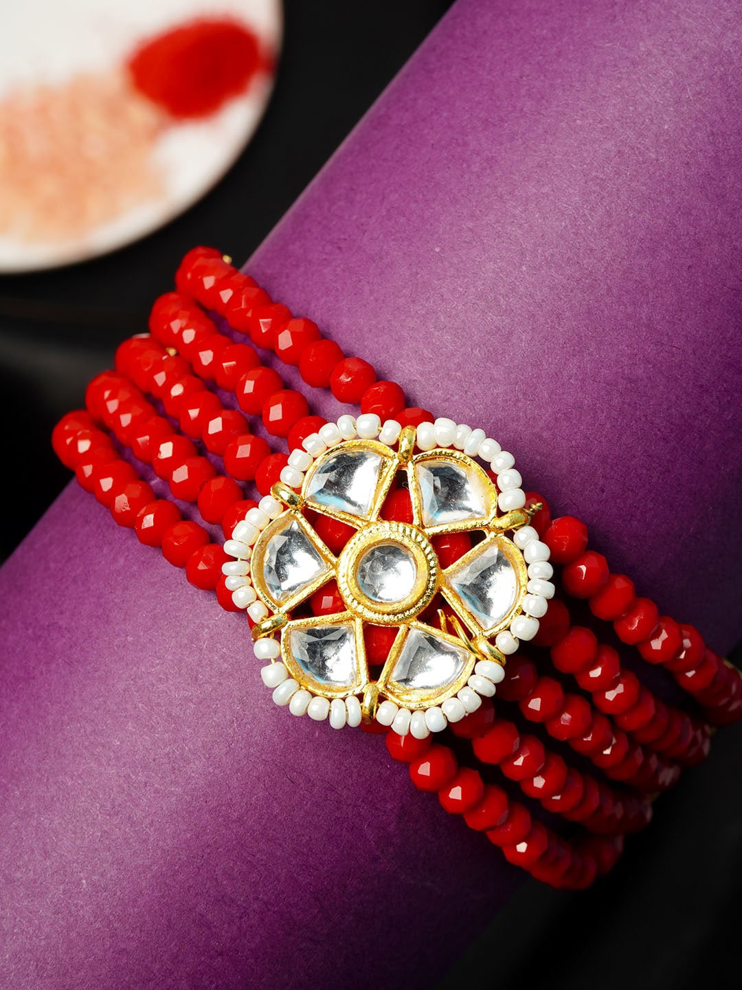 

Urmika Men Red Coloured Beaded Rakhi