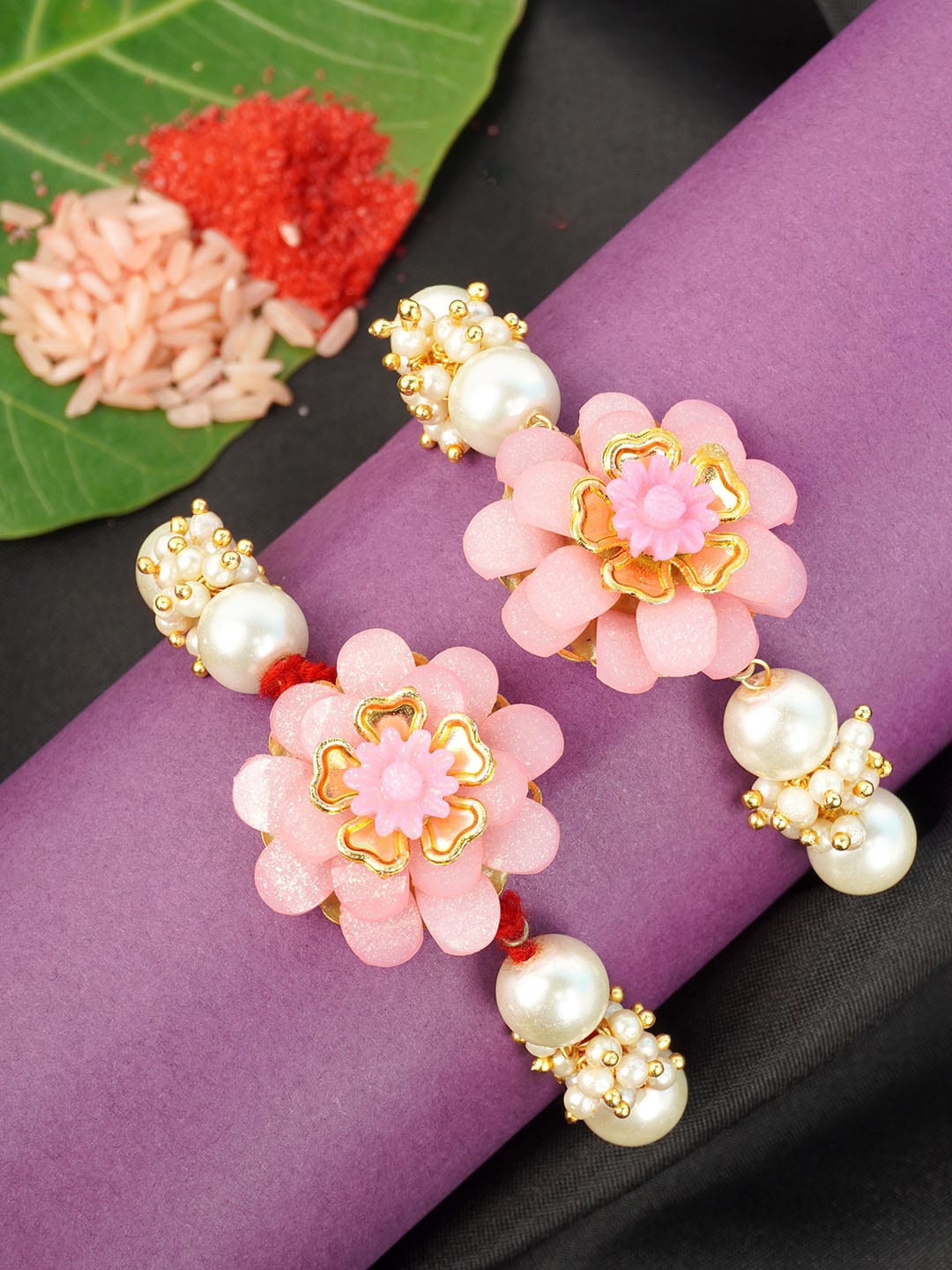 

Urmika Men Set Of 2 Gold-Toned & Pink Ethinic Rakhis