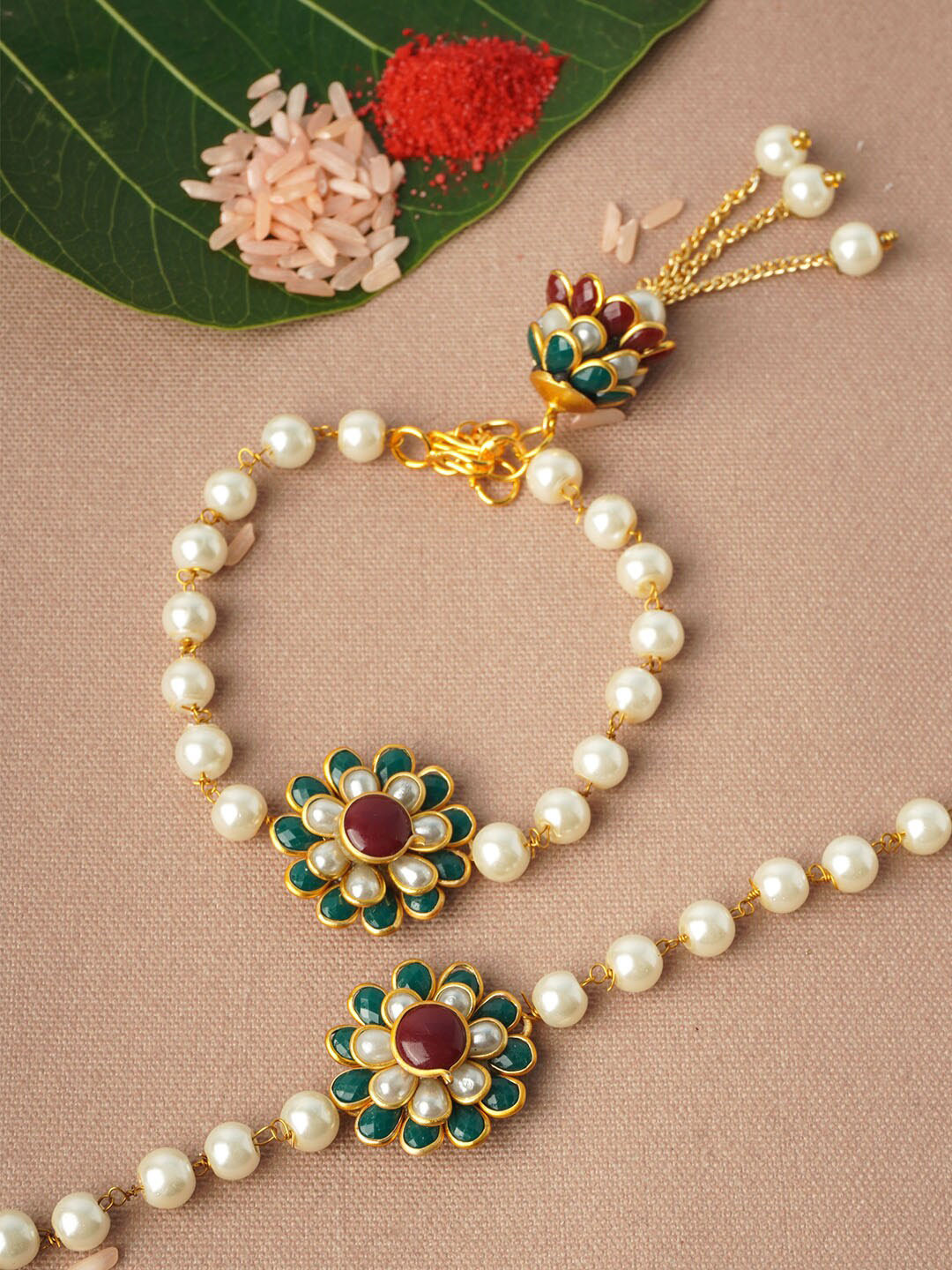

Urmika Set of 2 White & Green Floral Rakhis With Roli Chawal