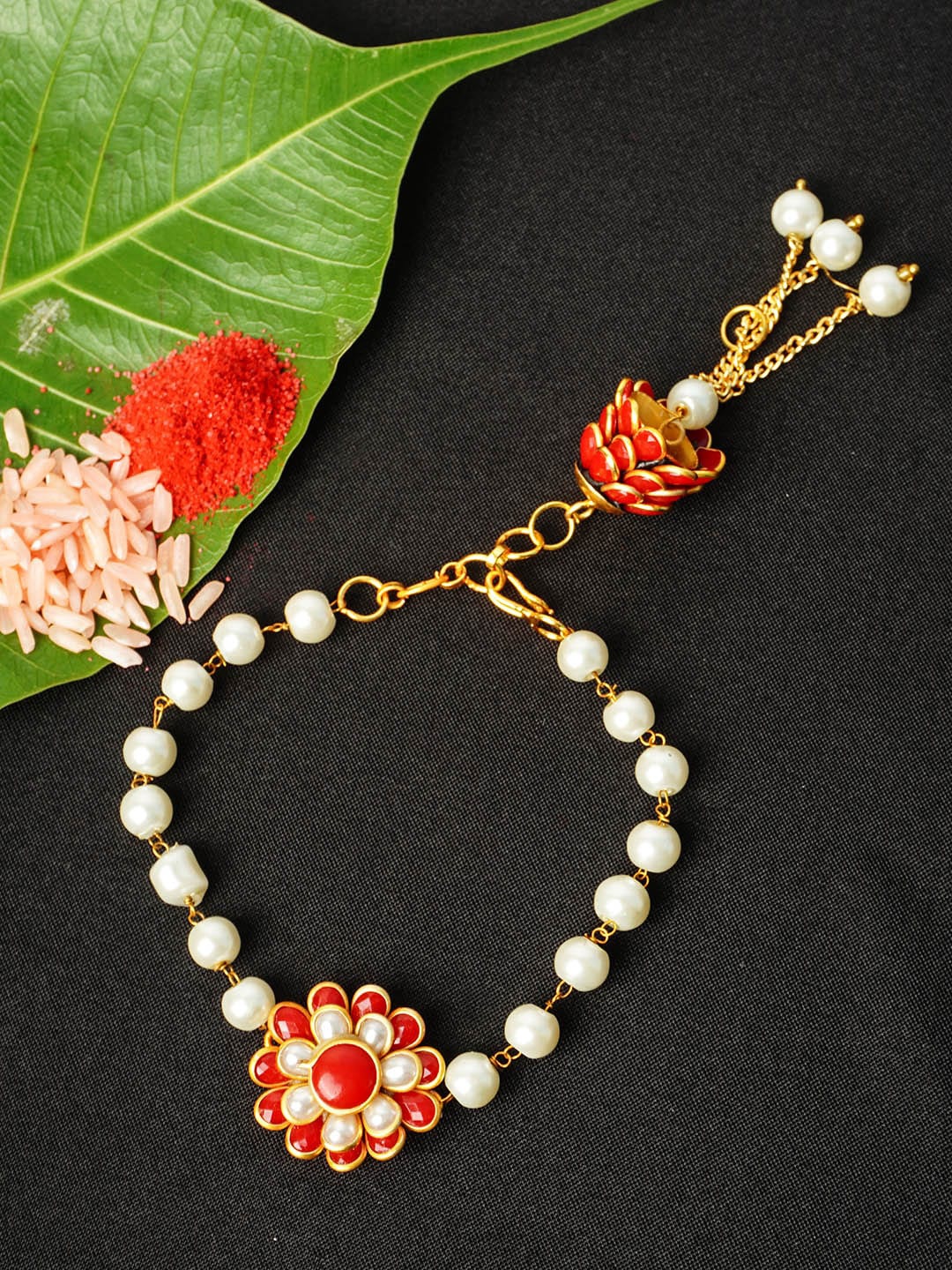 

Urmika Men Red & White Pearl Beaded Floral Rakhi