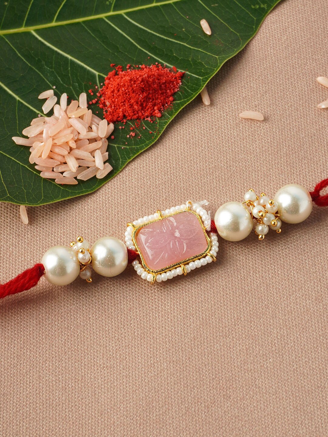 

Urmika Men Pink Crystal Rakhi