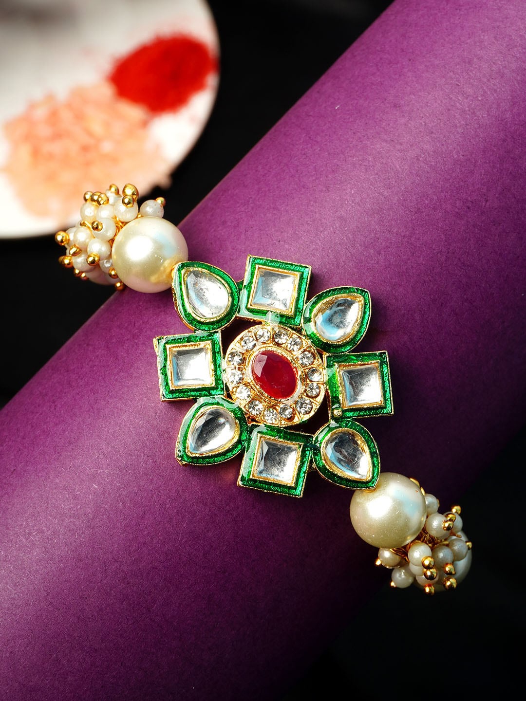 

Urmika Men White & Green Crystal Stone-Studded & Pearl Beaded Floral-Charm Rakhi With Roli Chawal