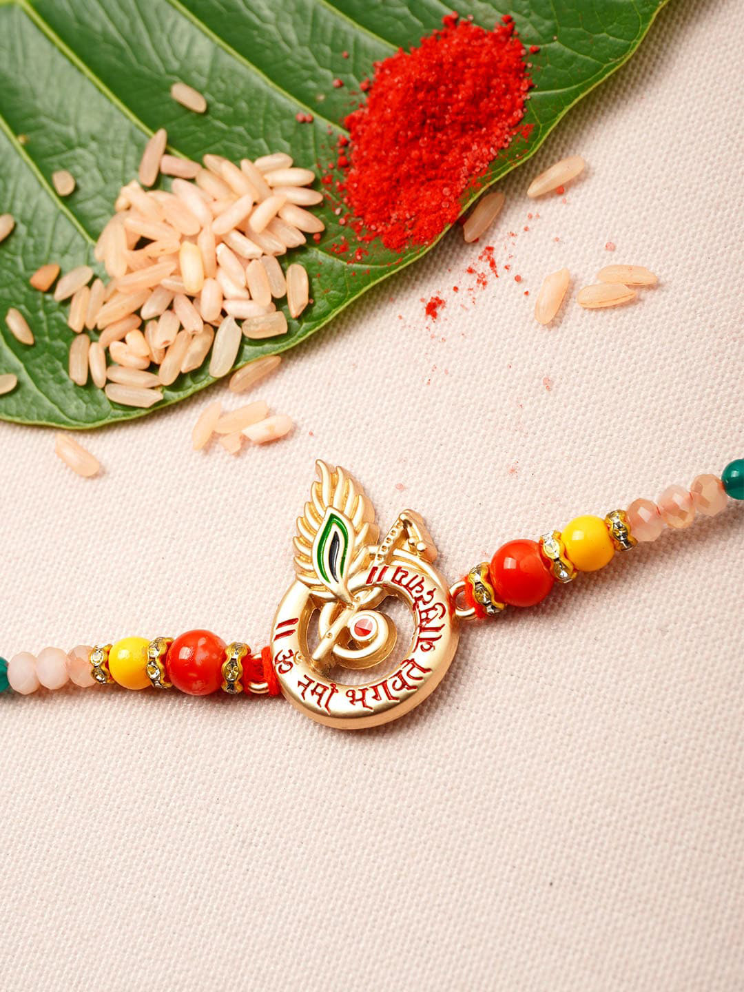 

Urmika Men Gold-Toned & Red Beaded Rakhi