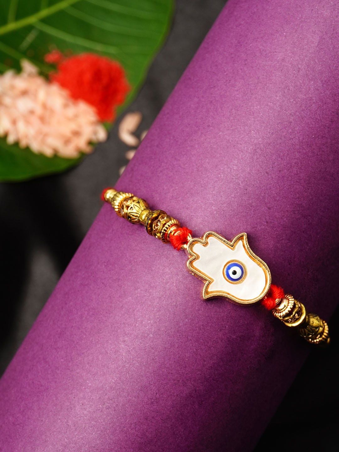

Urmika Men Gold Evil Eye Rakhi
