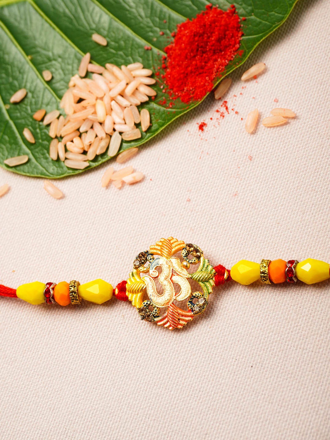 

Urmika Men Yellow & Red Rakhi & Roli Chawal