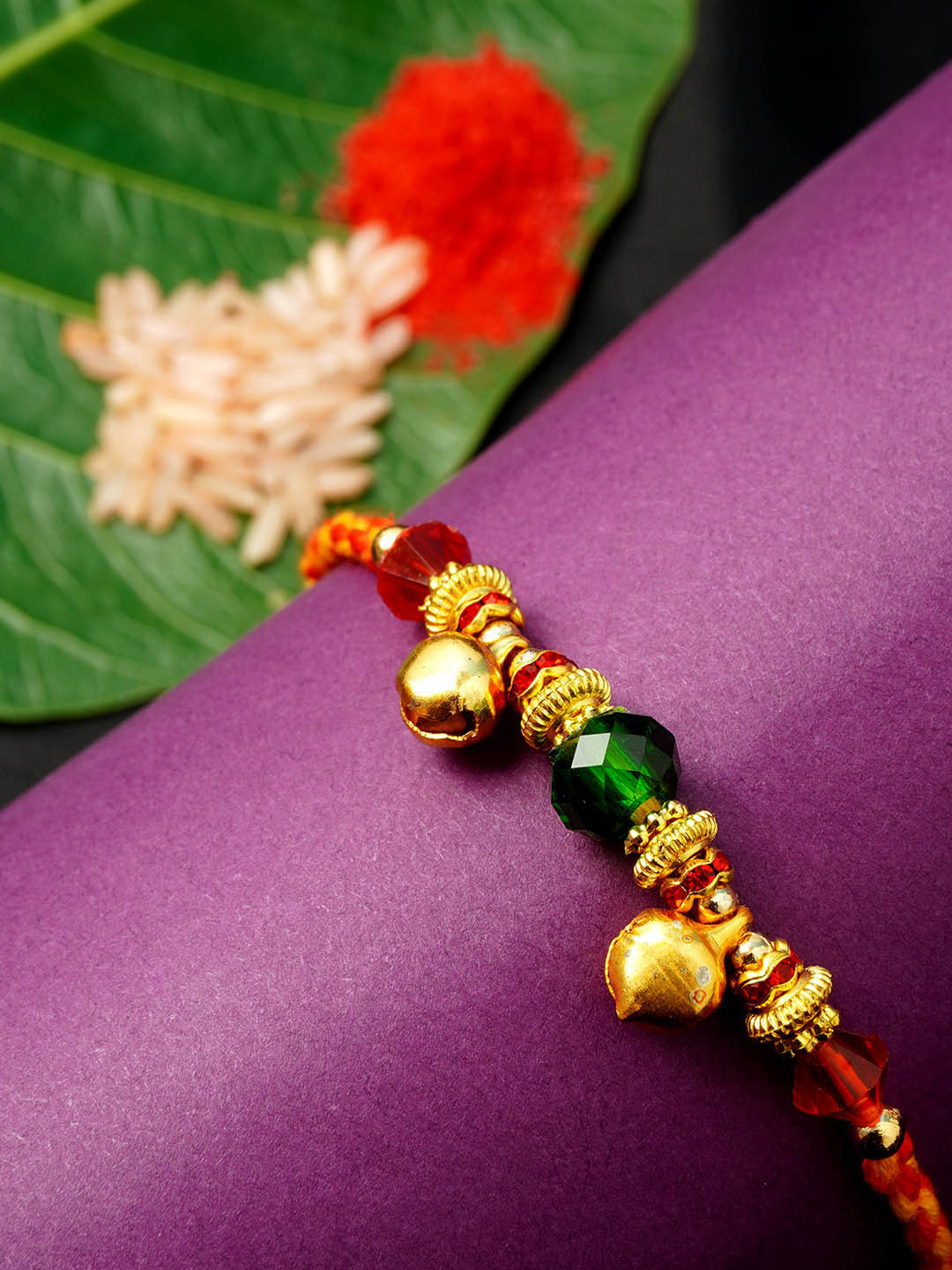 

Urmika Men Gold-Toned & Red Crystal Studded Rakhi & Roli Chawal