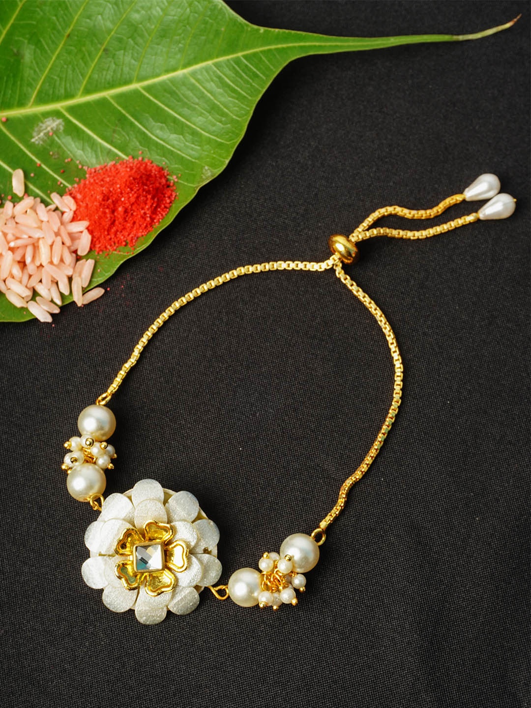 

Urmika Men Gold-Toned White Stone-Studded & Beaded Rakhi