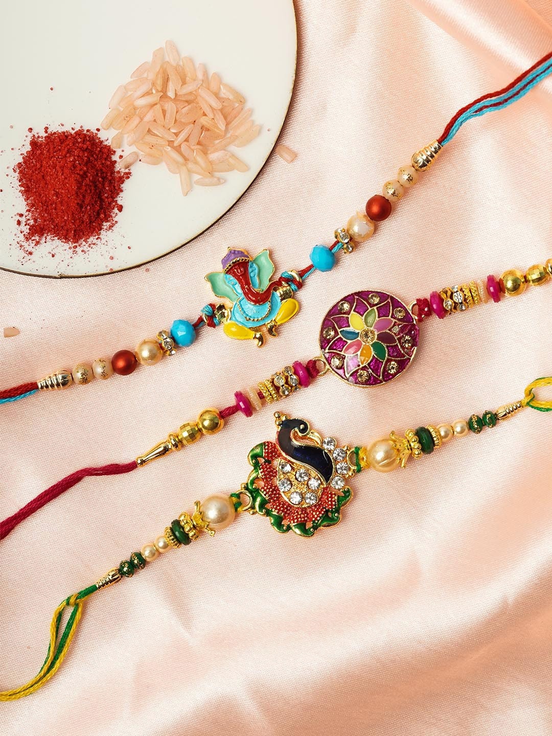 

Urmika Men Set Of 3 Multicoloured Shri Ganesh Rakhi & Roli Chawal, Multi