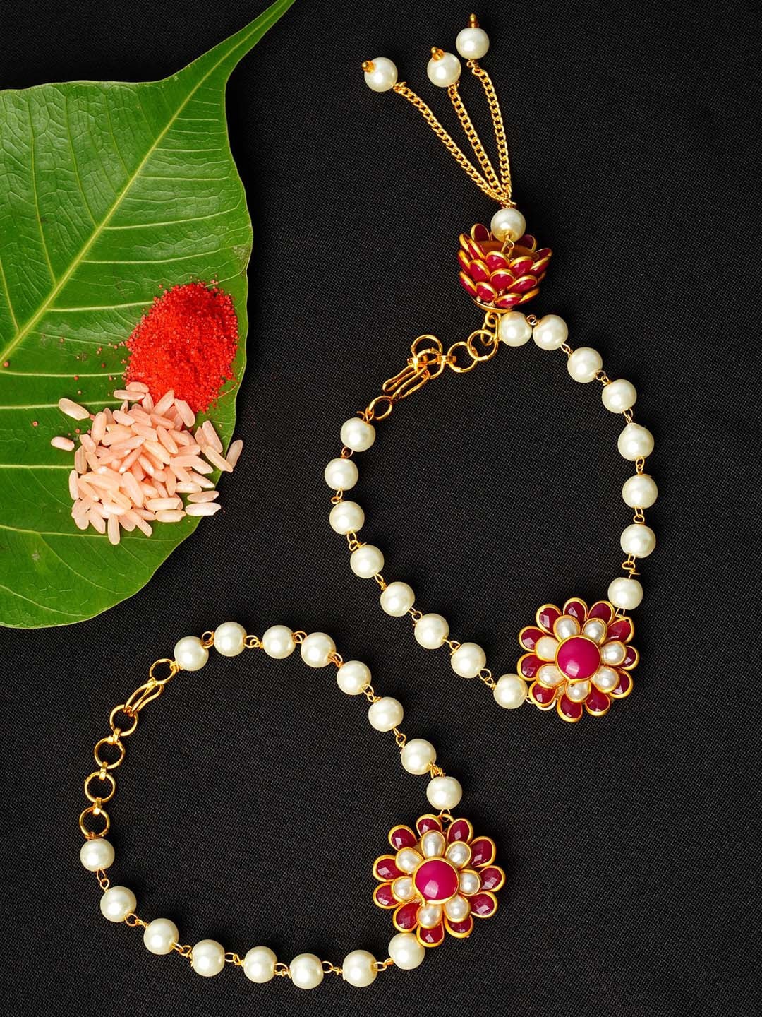 

Urmika Men Set Of 2 White & Pink Stone-Studded & Beaded Floral-Carm Rakhi With Roli Chawal