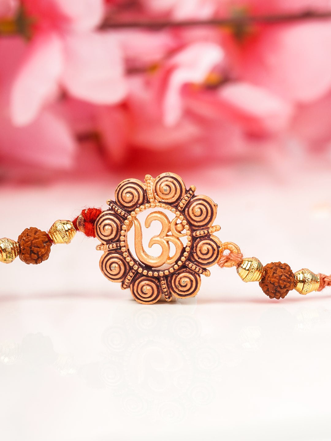 

Urmika Men Gold-Toned & Red Mandala Om Rakhi