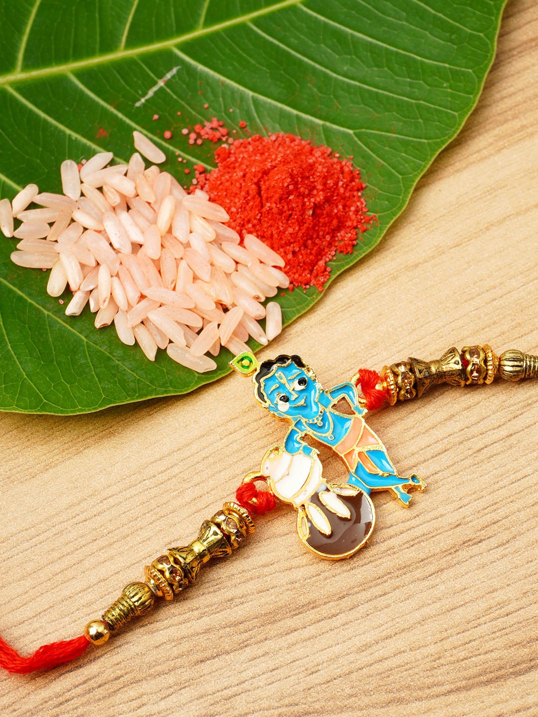 

Urmika Men Gold-Coloured Beaded Rakhi With Roli Chawal