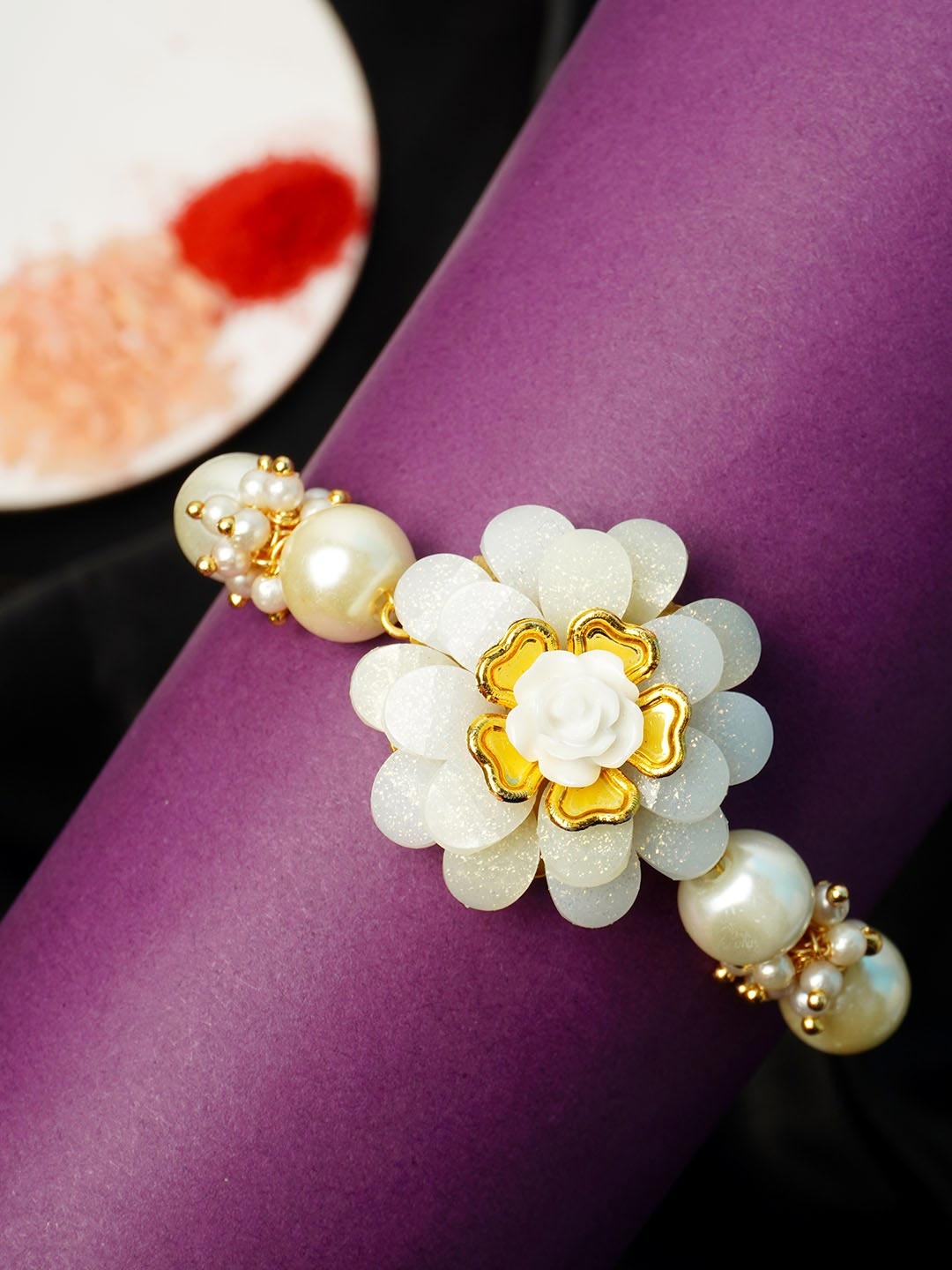 

Urmika Men Gold-Toned White Beaded Rakhi