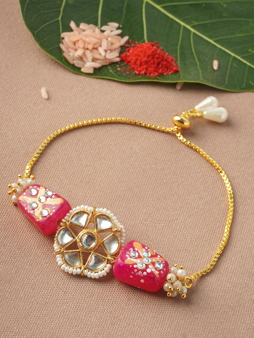 

Urmika Men Pink Stoned Rakhi