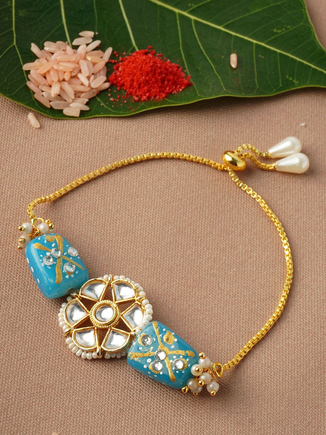 

Urmika Men Blue Stone Studded Rakhi