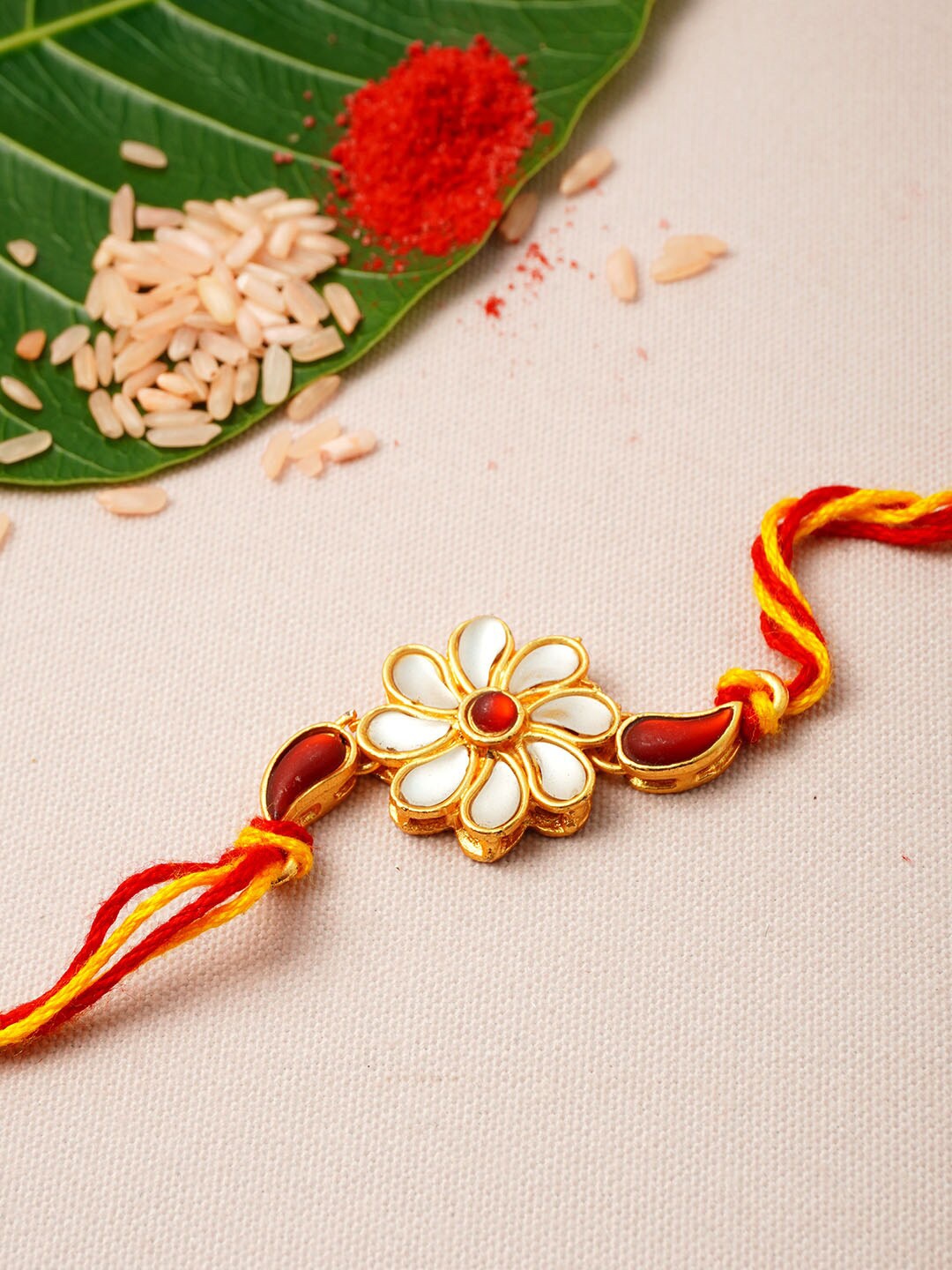 

Urmika Men Gold Toned & Red Beaded Thread Rakhi