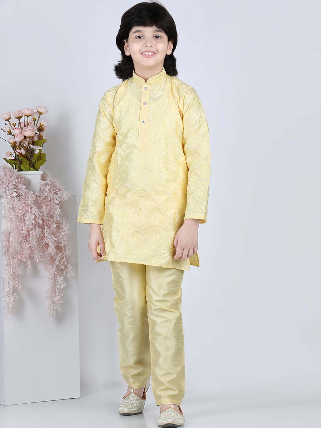 

Aj DEZInES Boys Yellow Angrakha Raw Silk Kurta with Churidar