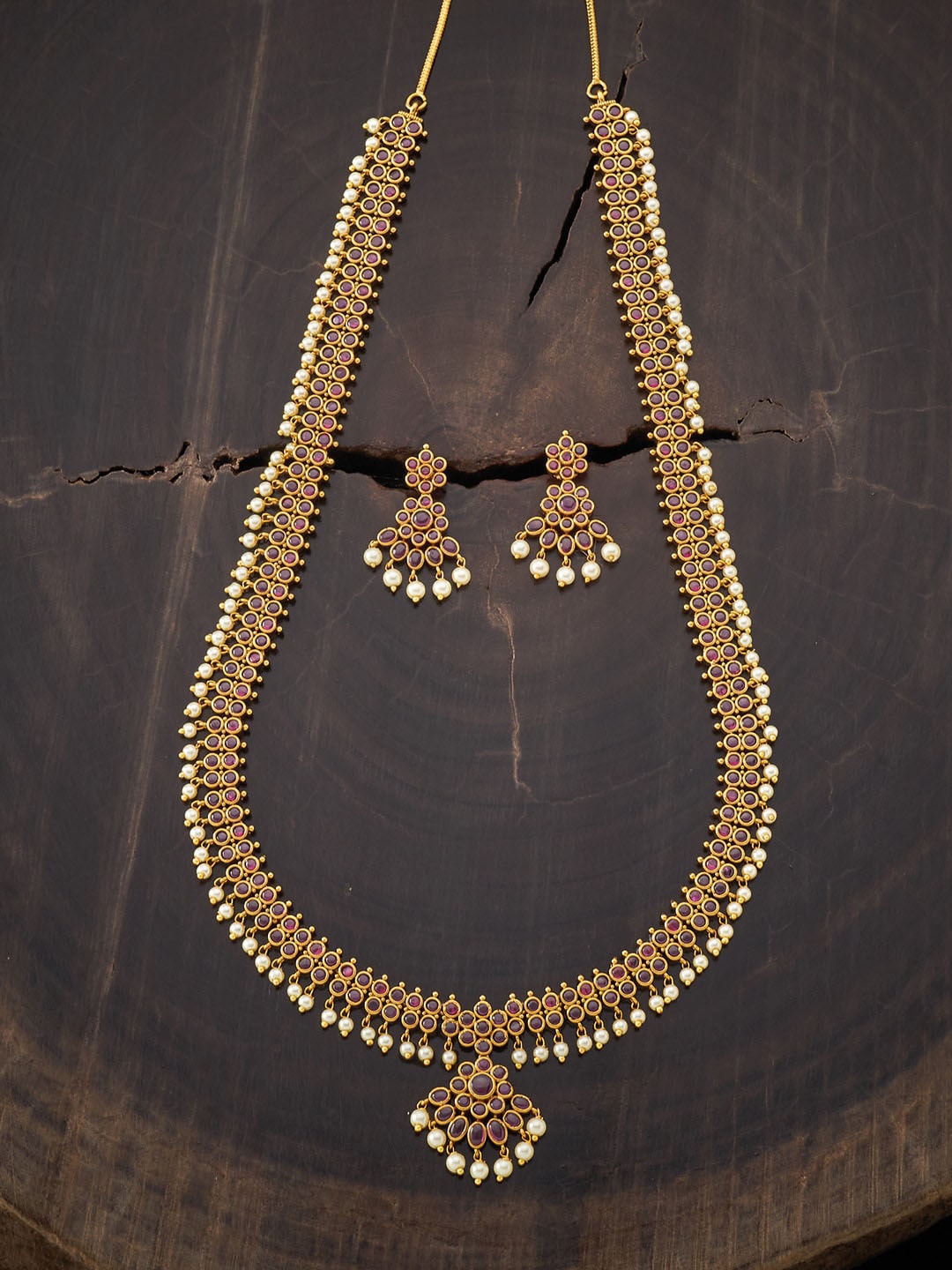 

Kushal's Fashion Jewellery Gold-Plated Red Stone Studded & Beaded Long Jewellery Set