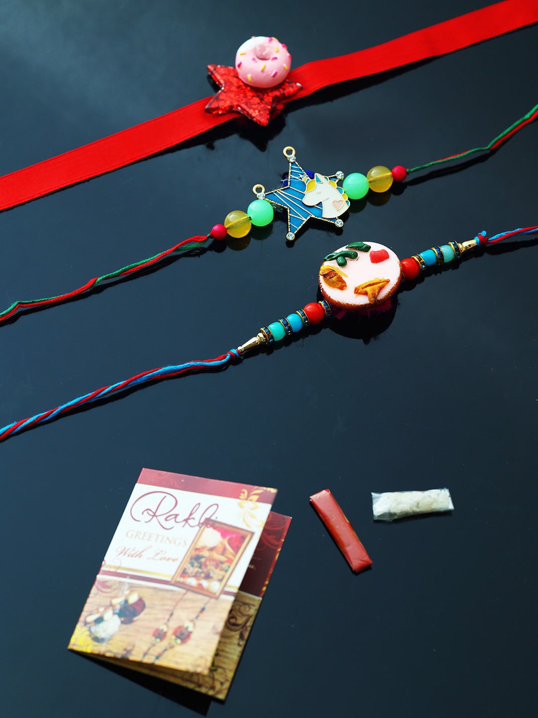 

PASSION PETALS Red Rakhi Set