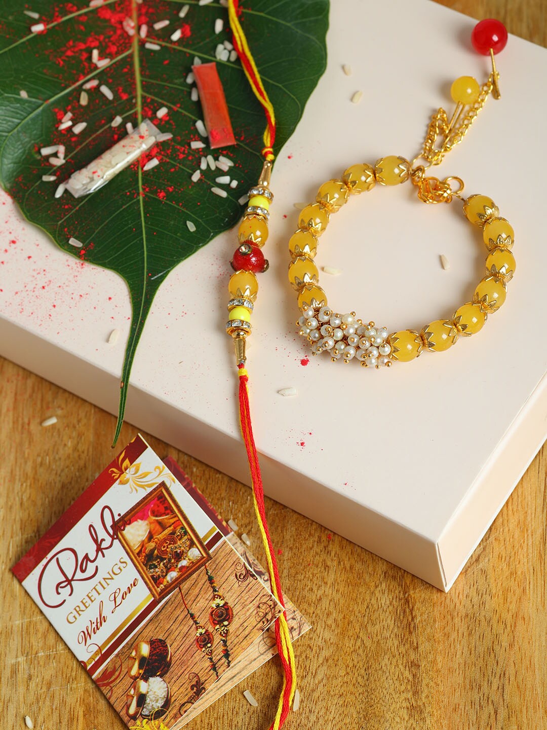 

PASSION PETALS Yellow Bhaiya Bhabhi Rakhi Set