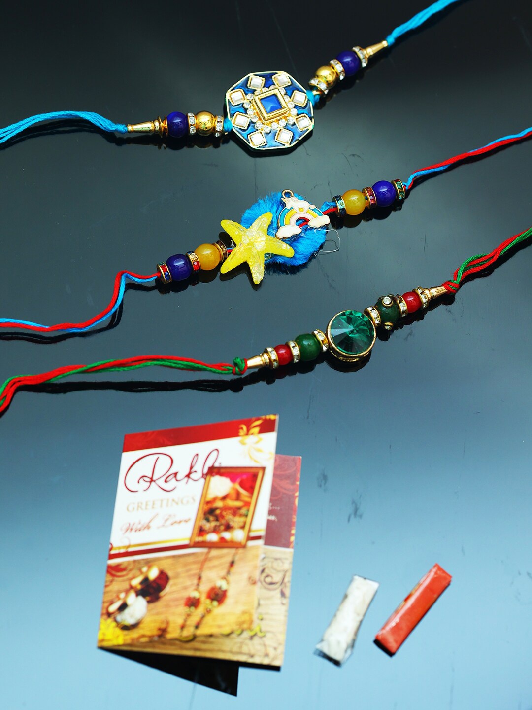 

PASSION PETALS Blue Rakhi Set