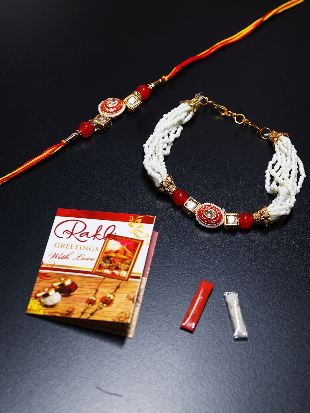 

PASSION PETALS Orange & Red Bhaiya Bhabhi Rakhi Set