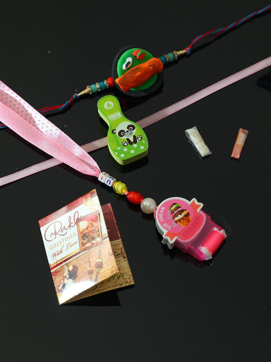 

PASSION PETALS Set of 3 Rakhis with Roli Chawal & Greetings Card, Multi
