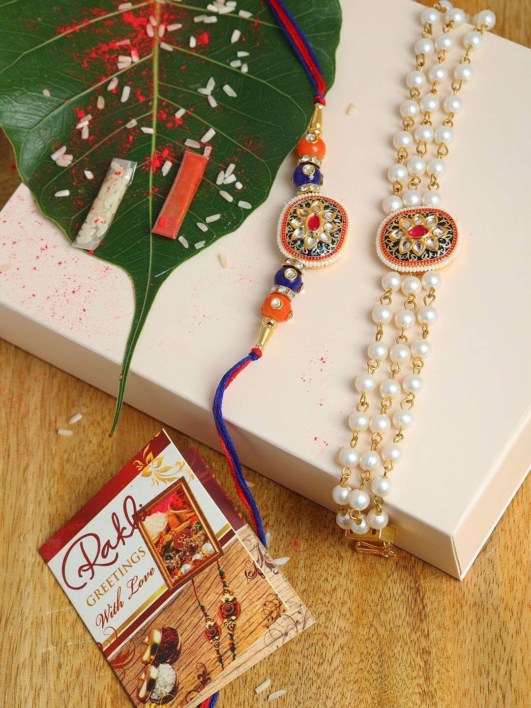 

PASSION PETALS White & Blue Pearls Beaded Rakhi