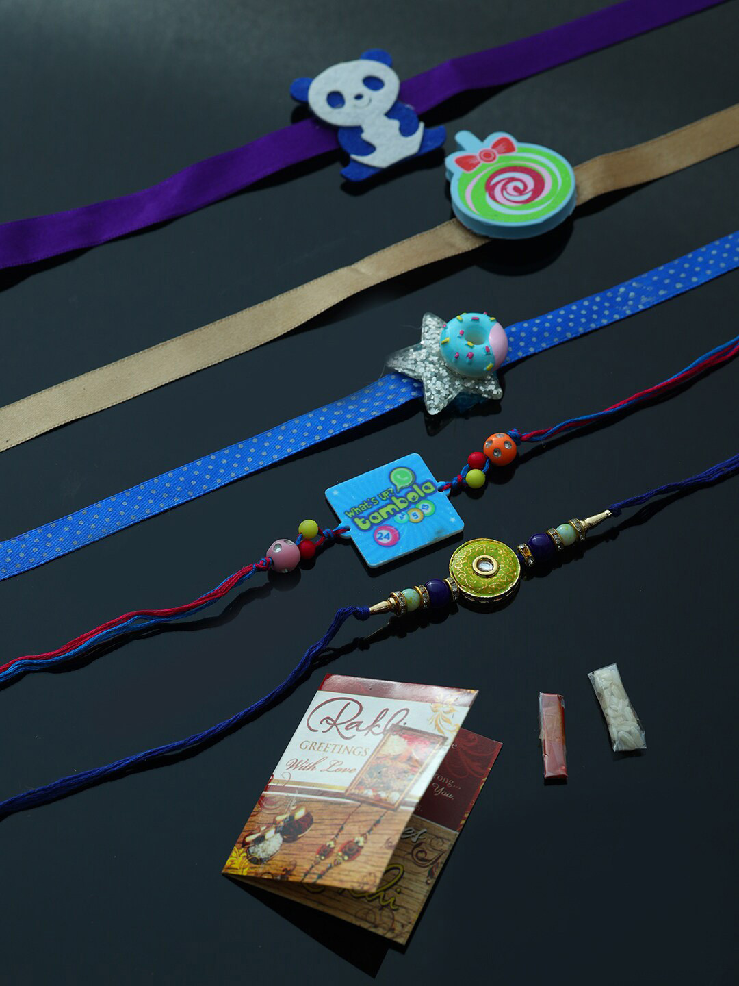 

PASSION PETALS Pack of 5 Multicoloured Rakhi with Roli Chawal, Multi