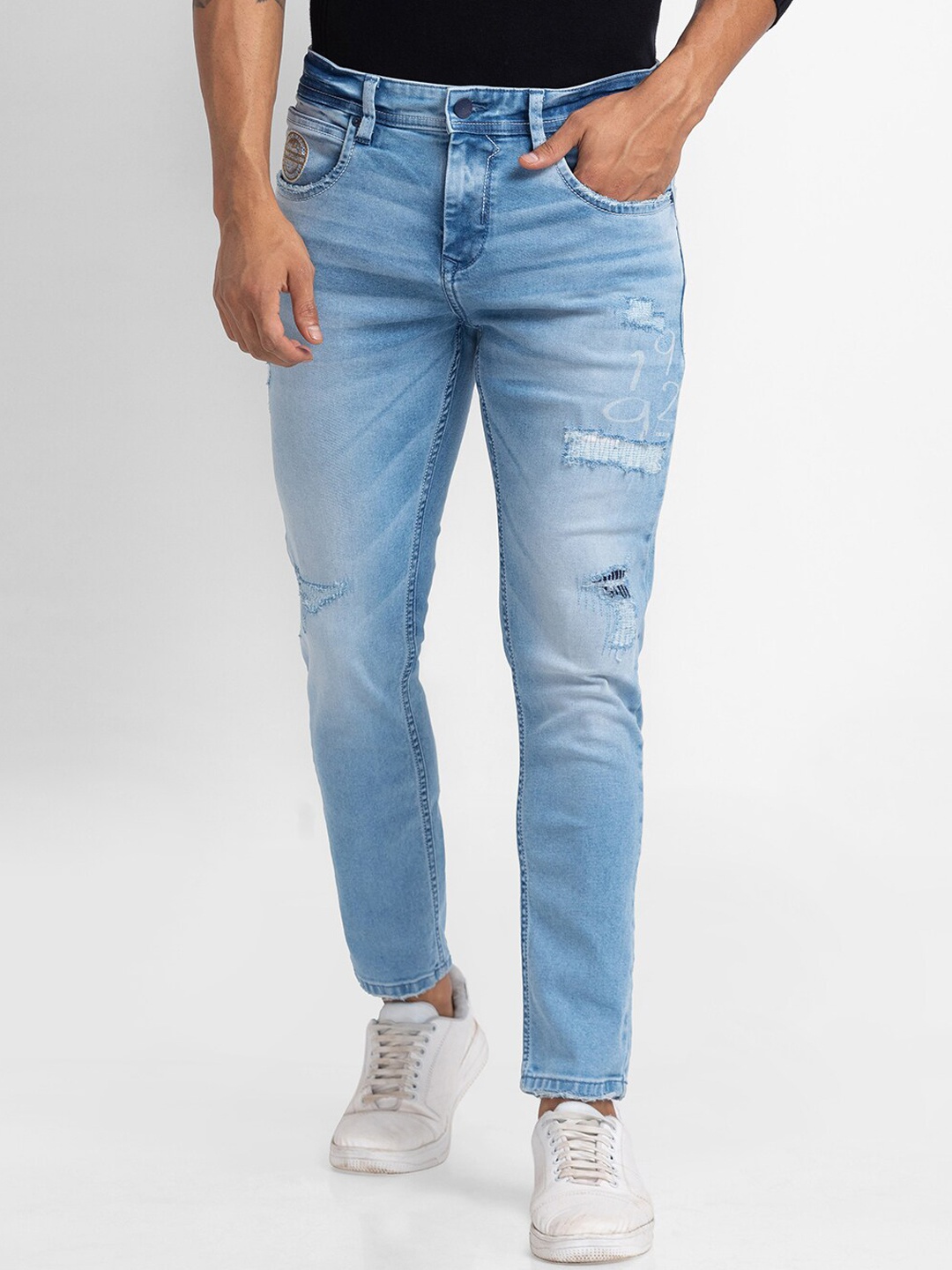 

SPYKAR Men Blue Tapered Fit Mildly Distressed Heavy Fade Jeans