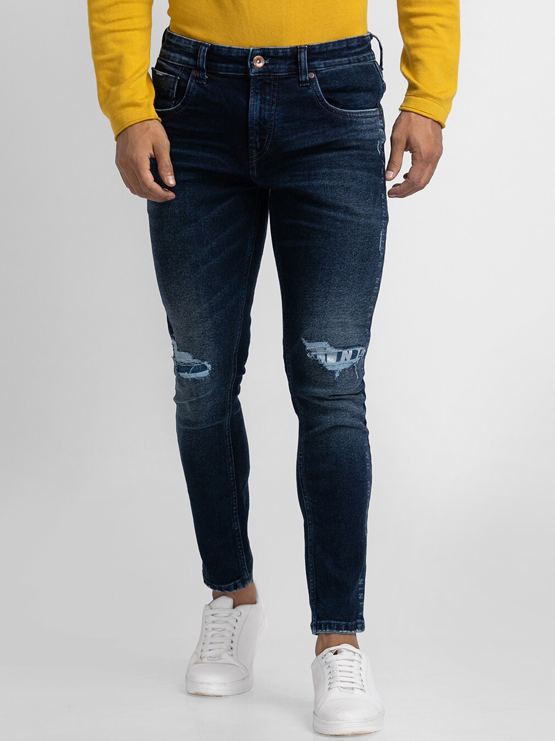 

SPYKAR Men Blue Tapered Fit Mildly Distressed Light Fade Jeans